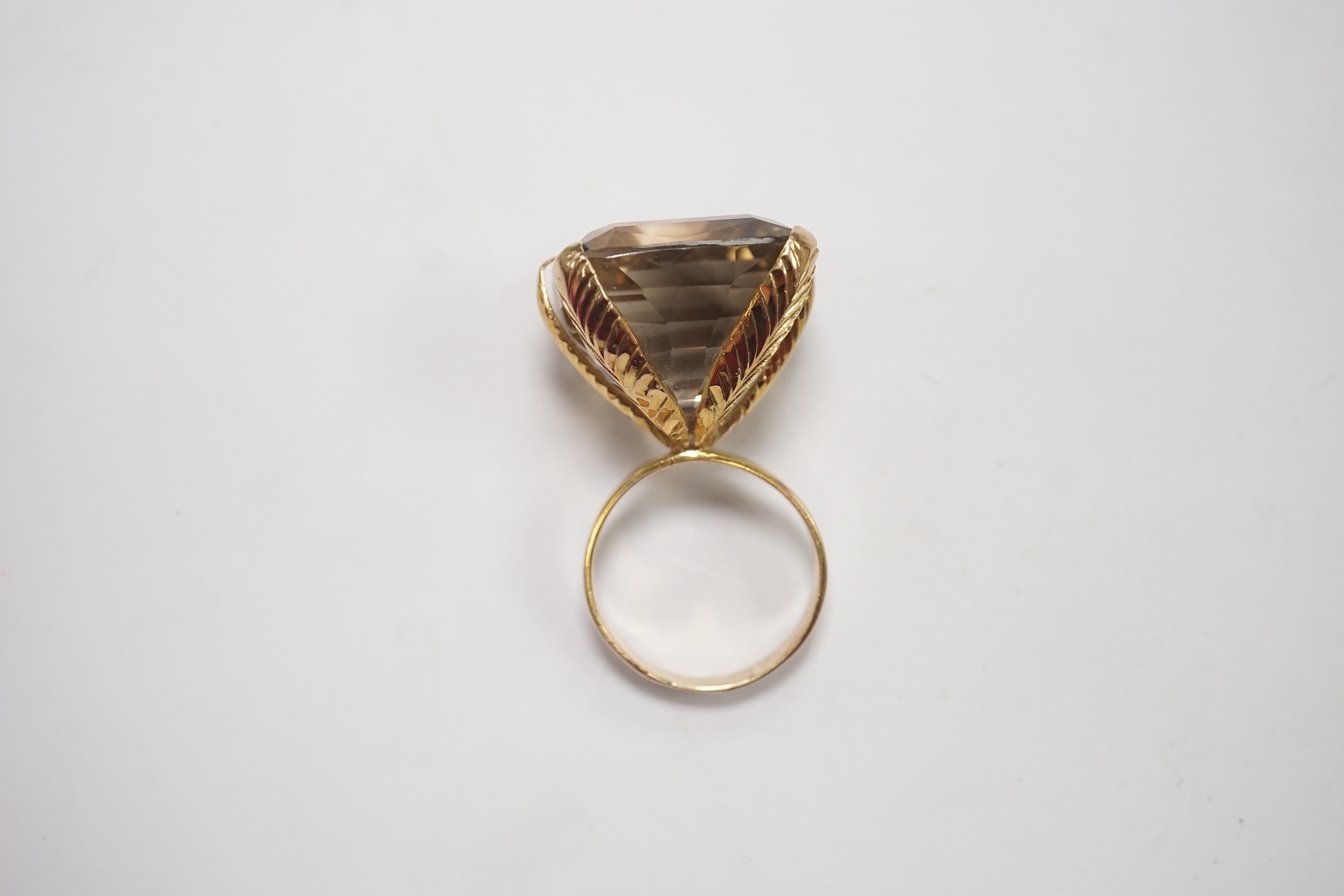 An 18k and large single stone smoky quartz set dress ring, size Q, gross weight 20.3 grams. Condition - fair to good